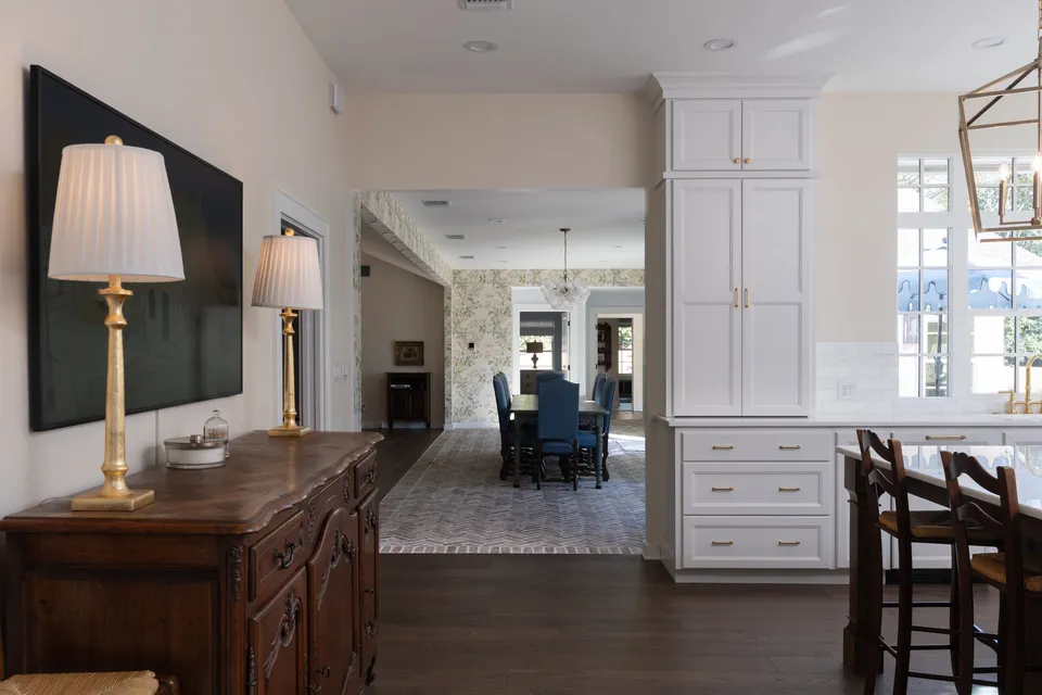 Antique sideboard and lamps with a view through to the dining room